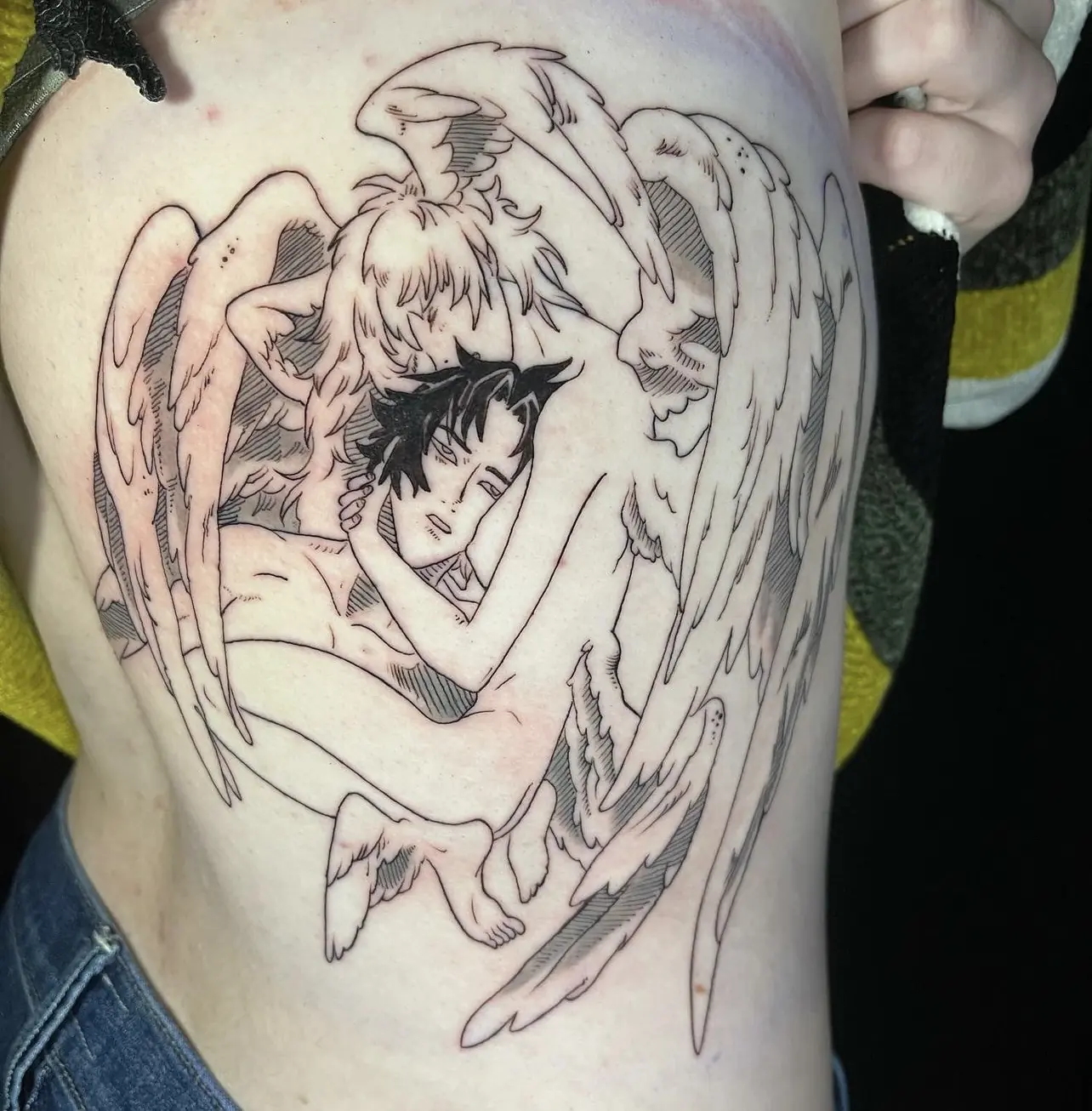 Fine-line anime angel scene tattoo by Keith