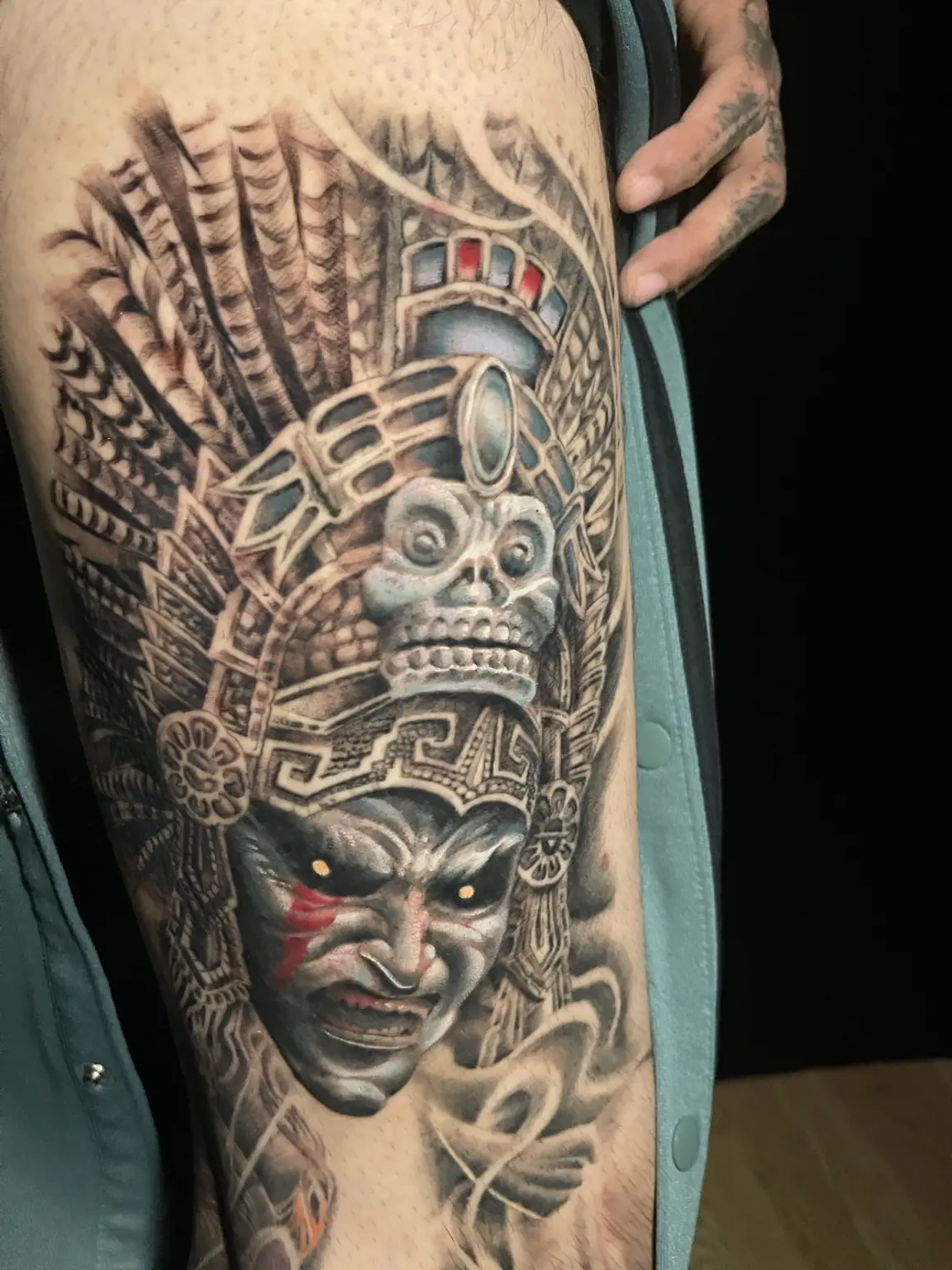Black-and-gray Mesoamerican warrior sleeve tattoo by Keith