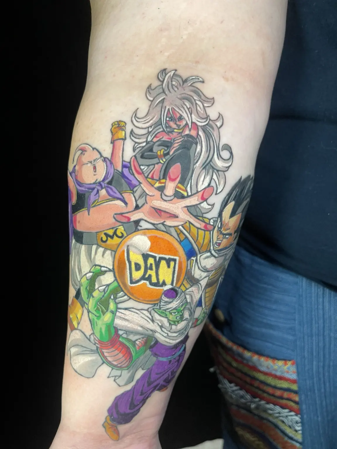 Full-color comic character forearm tattoo by Keith