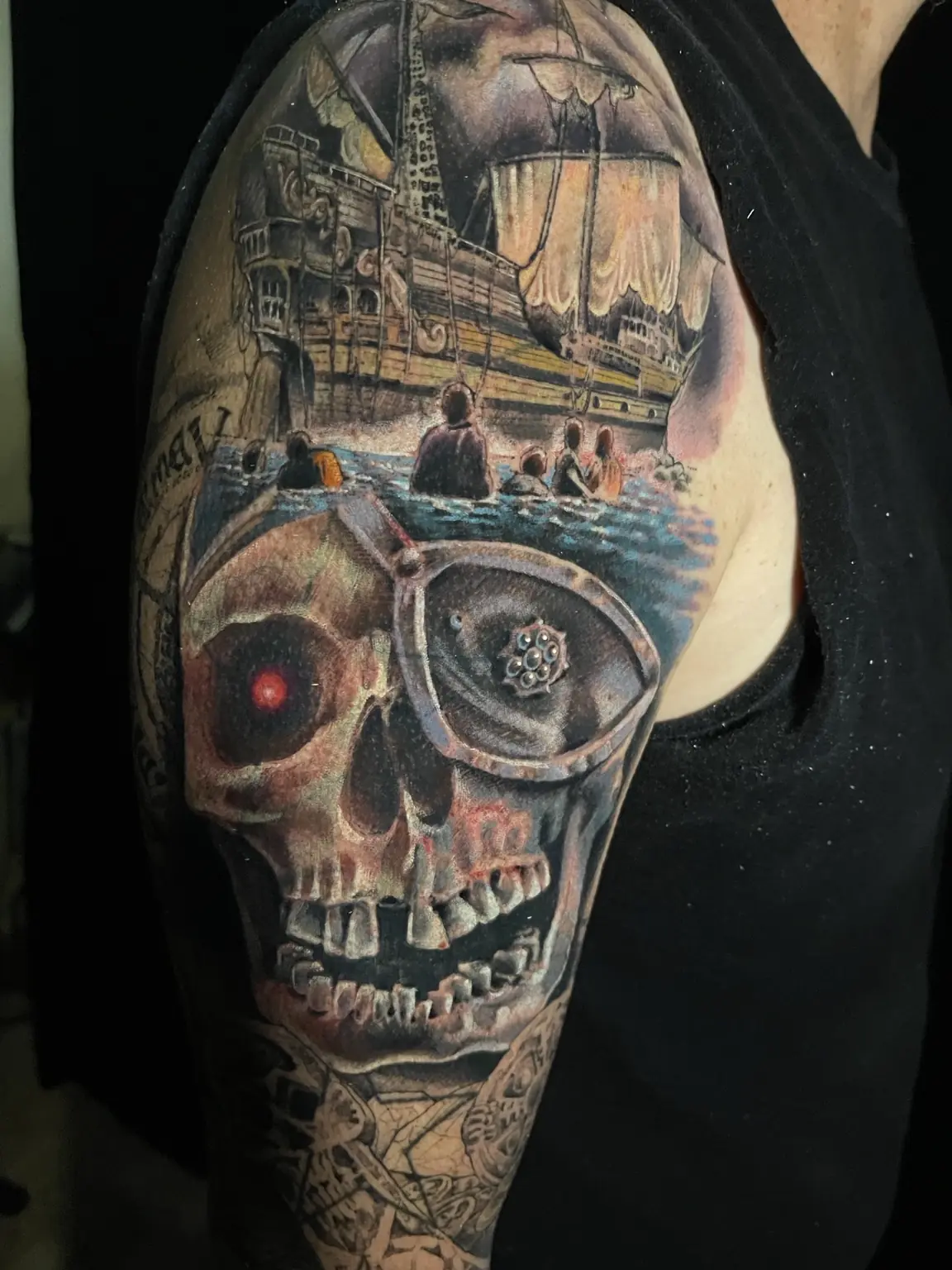 Black-and-gray Detroit skyline and skull tattoo by Keith