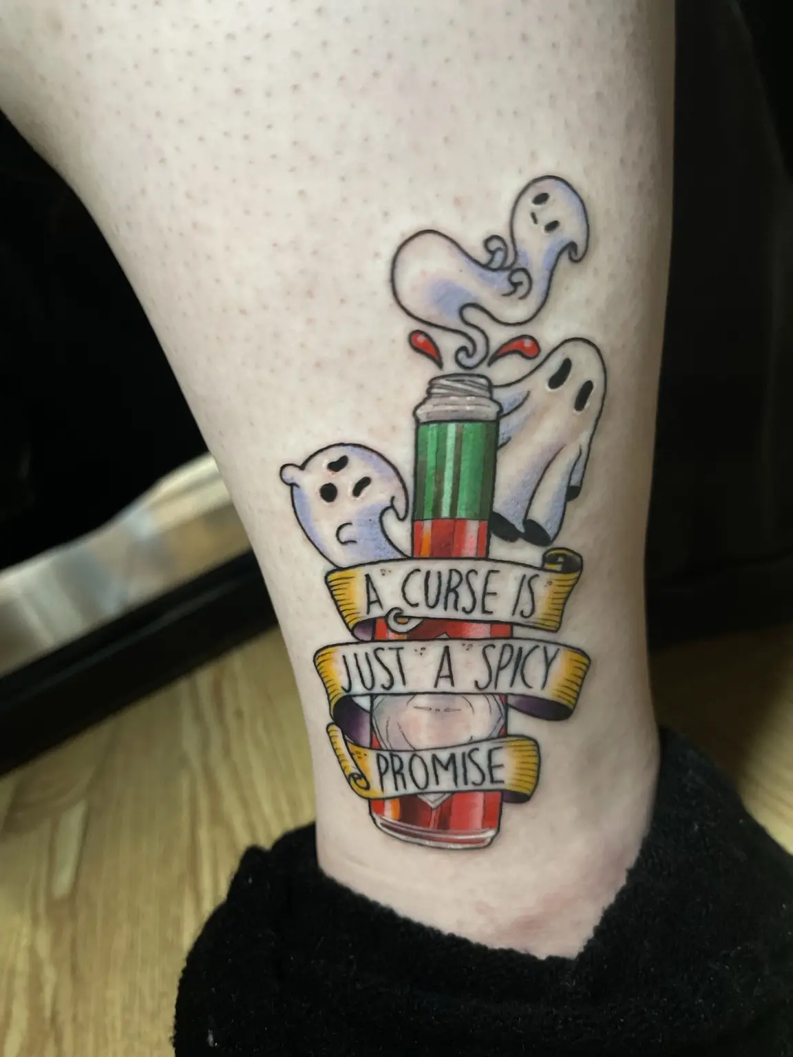 Color ghost illustration and quote ribbon tattoo by Keith