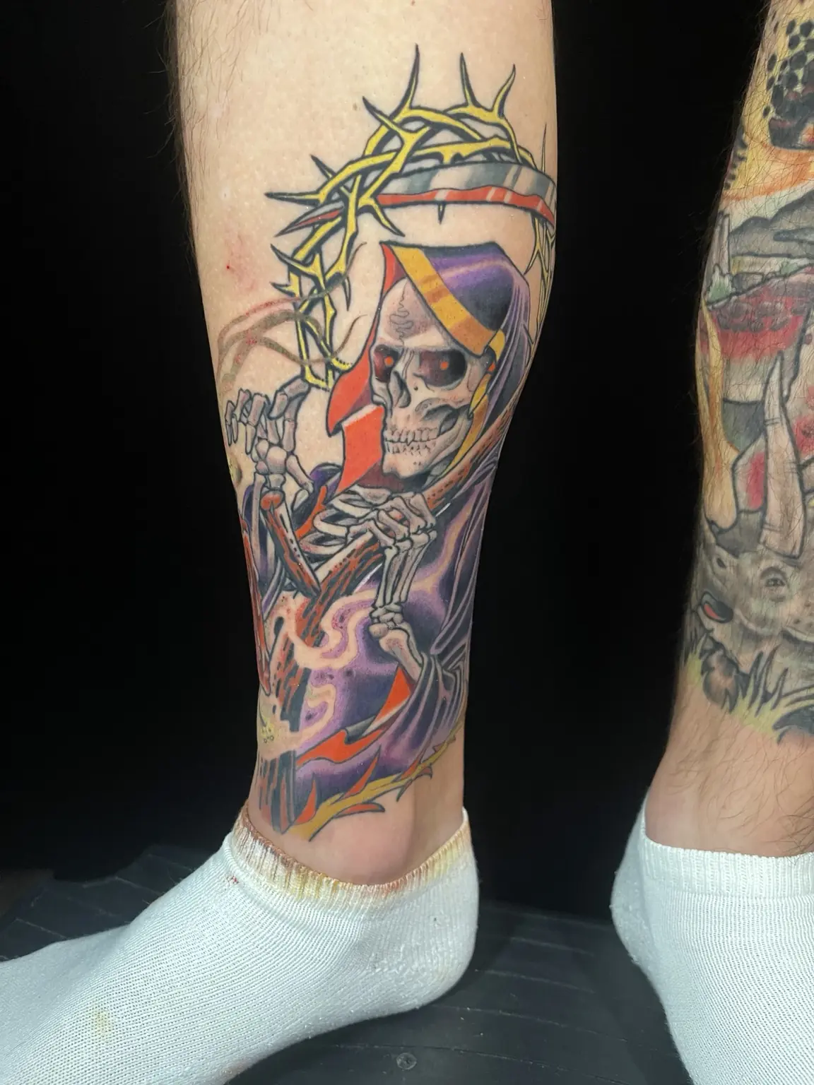 Full-color grim reaper calf tattoo by Keith