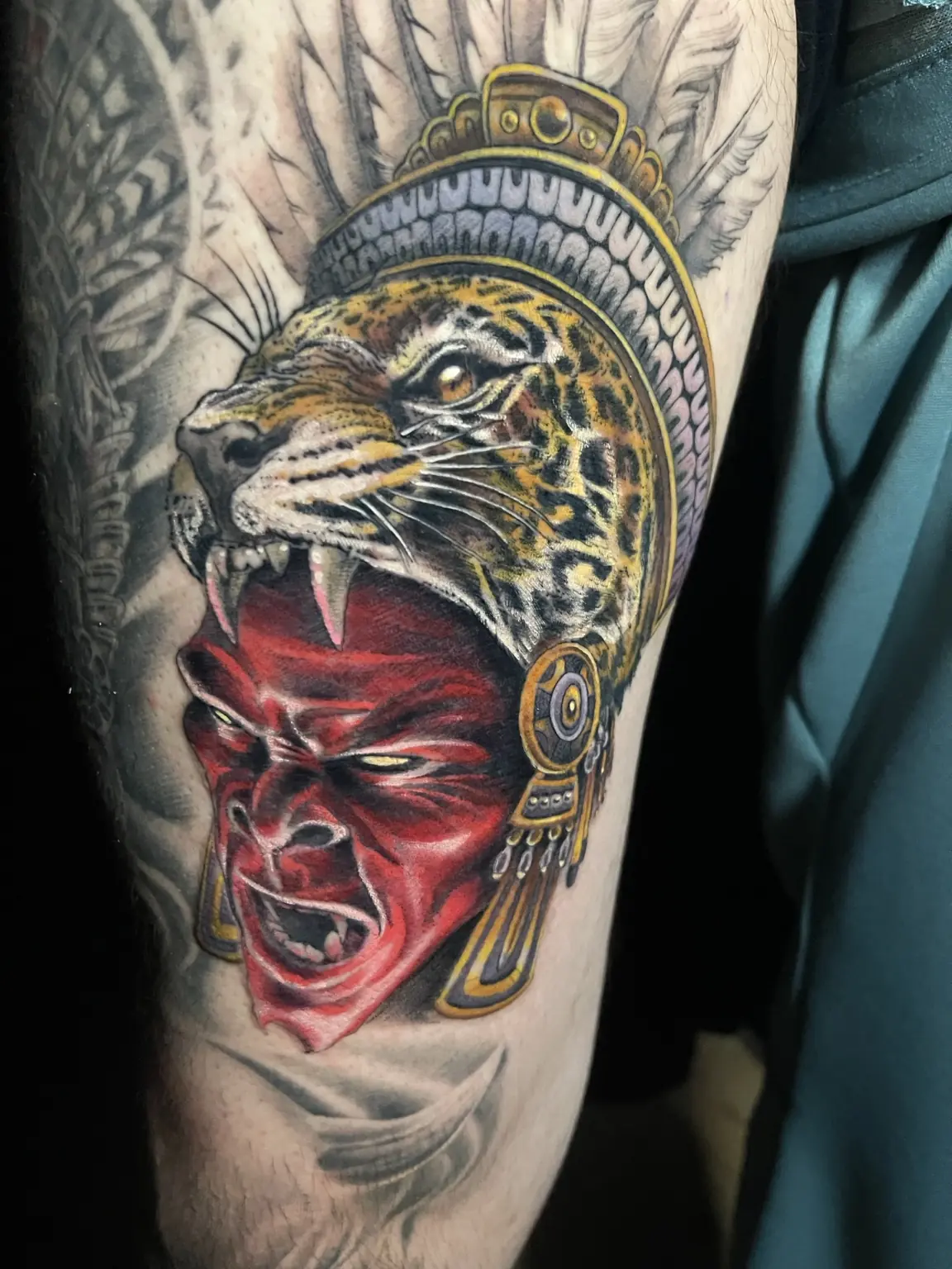 Black-and-gray jaguar and Mesoamerican warrior tattoo by Keith