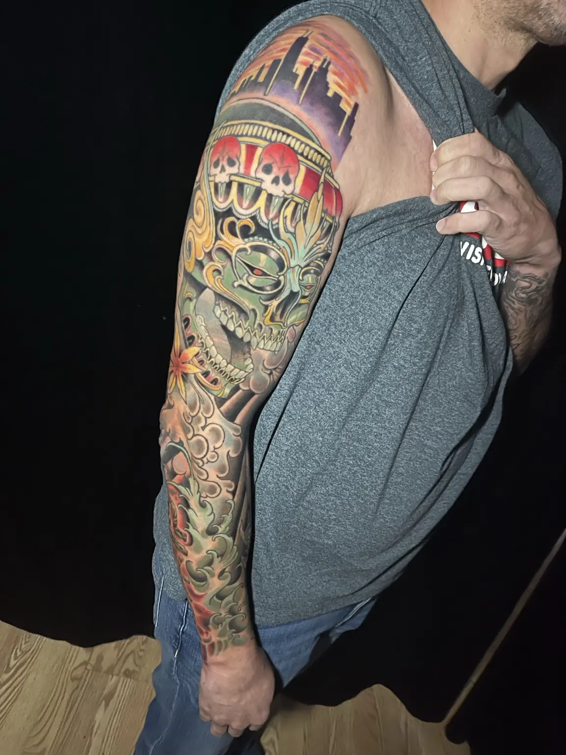 Full-color Japanese-inspired oni and floral sleeve tattoo by Keith
